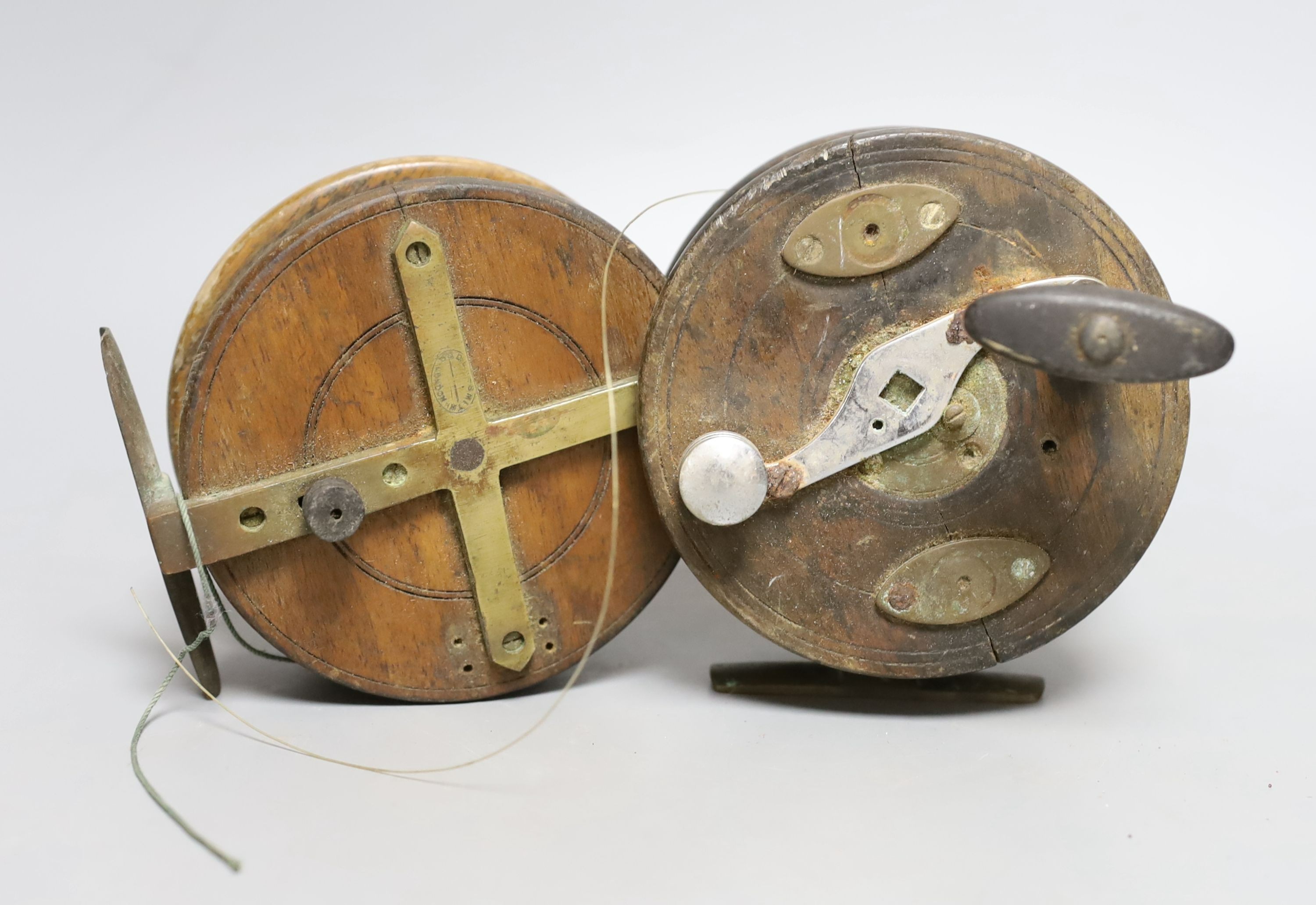 Vintage Ogden Smith fishing reel together with another